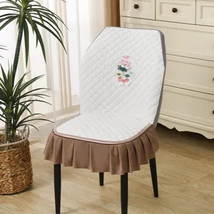 Elastic dining chair cover with exquisite lotus embroidery and brown ruffle skirt design.