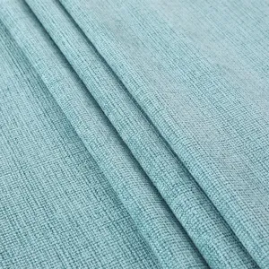 Primo piano dettagliato del tessuto strutturato azzurro, drappeggio morbido e ottima consistenza.