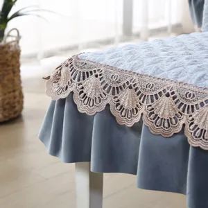 Grey quilted dining chair cover with delicate lace trim, elegant home decor protect seat.