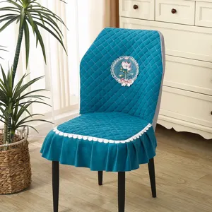 Quilted dining chair cover with floral lace embroidery, elastic curved seat protector for home.
