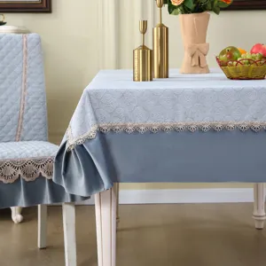 Elegant grey-blue dining chair cover and tablecloth set with delicate lace trim for home decor.