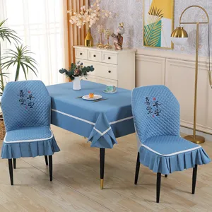 Blue quilted elastic dining chair cover and tablecloth set detailed view for home decor.