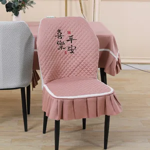 Pink quilted dining chair cover with elegant skirt and Chinese embroidery for home decor