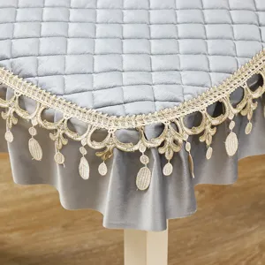 Grey quilted table cloth detail, luxury golden lace trim, elegant home textile