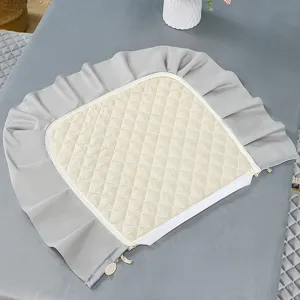 Italian velvet dining chair cushion with elegant ruffled skirt and quilted pad for home decor.