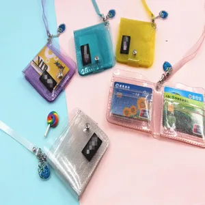 Macro view of various colorful glitter clear PVC card holders with matching lanyards