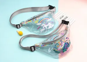 Close-up of two transparent PVC unicorn fanny packs with colorful prints and adjustable grey straps
