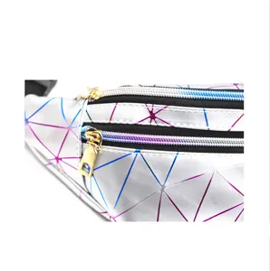 Close-up of holographic geometric fanny pack with gold-tone zippers and laser PU finish.