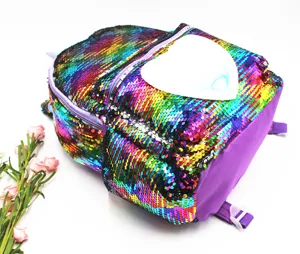 Close-up detail showing the colorful rainbow sequins and heart patch on this cute backpack