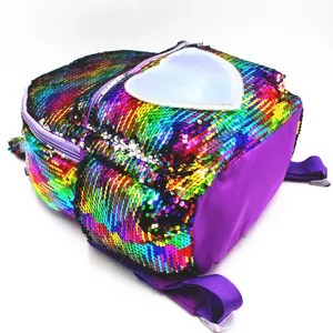 Detailed view of colorful reversible mermaid sequin backpack with a white heart patch