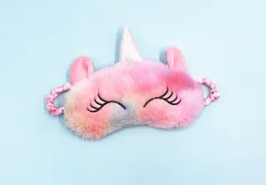 Macro view of plush gradient unicorn sleep mask with soft texture and embroidered eyes