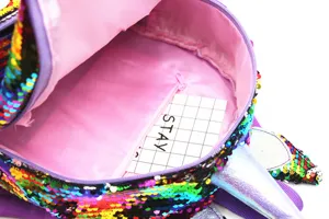 Detailed internal view of pink lined unicorn sequin backpack with zipper pocket
