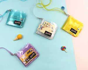 Macro detail showing four colors of blingbling PVC neck wallets on a bright background.