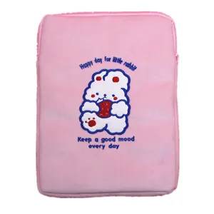 Pink plush laptop sleeve featuring cute white rabbit embroidery and cheerful text