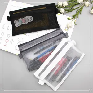 Detailed view of double-layer mesh stationery pouches in black, grey, and white colors