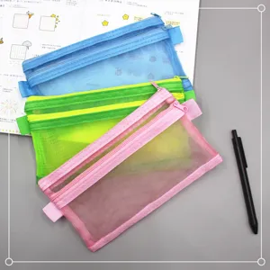 Detailed view of colorful double-layer mesh pencil cases in vibrant blue, green and pink