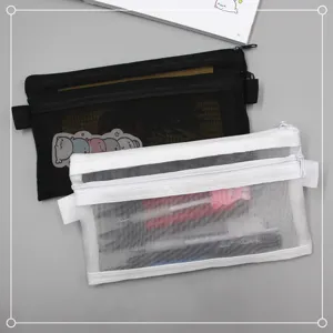 Detail of black and white double-layer mesh pencil cases with zippers