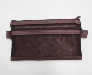 Detailed view of brown double-layer mesh storage pouch with durable metal zippers