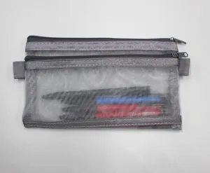 Close-up of a double-layer grey mesh pencil pouch containing various pens and markers.