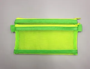 Detailed view of neon green double-layer mesh stationery bag with zipper closure