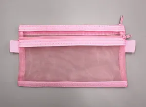 Detailed view of the double-layer pink mesh pouch featuring sturdy zippers and fine netting