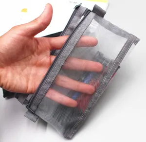 Detailed view of a gray double-layer mesh pencil case pouch with semi-transparent texture