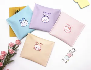 Set of cute pastel sanitary napkin storage pouches featuring cartoon animal designs