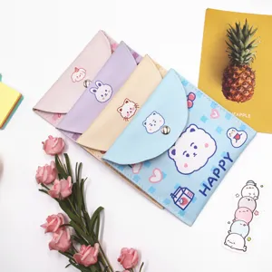 Detailed view of four cute animal-themed storage pouches in assorted pastel colors