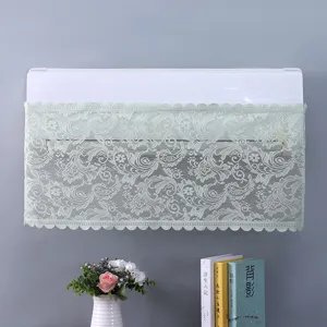 Vista dettagliata di una elegante copertura antipolvere in pizzo verde per condizionatore