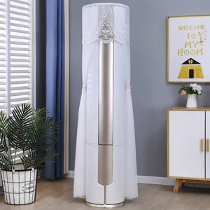 White lace and tulle dust cover for vertical cylindrical air conditioner in home setting.