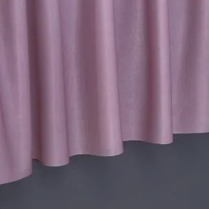 Close-up view of soft purple dust cover fabric showing fine texture and vertical drapes.