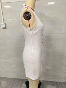 Side profile detail of a white sleeveless button-down midi dress on a professional mannequin