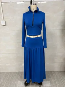 Detailed view of royal blue long-sleeve crop top and maxi skirt set on a mannequin