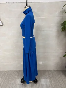 Side view of elegant blue long sleeve turtleneck top and long skirt set on mannequin
