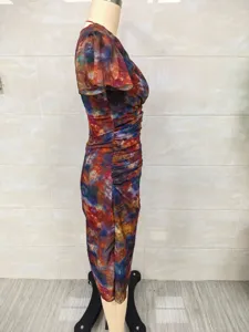 Side view of multi-color tie-dye ruched dress on mannequin showing slim fit detail