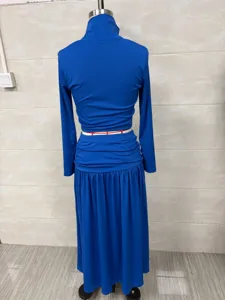 Back view of an elegant blue turtleneck top and low-waist maxi skirt set