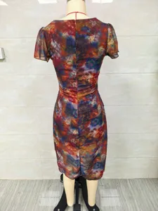 Back view of a slim fit midi dress featuring a vibrant tie-dye print and short sleeves.