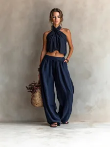 Navy blue two-piece set featuring a halter wrap top and wide-leg trousers for casual style