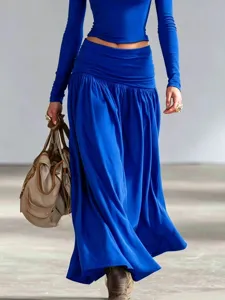 Elegant cobalt blue two-piece set featuring a tight top and flowing low-waist maxi skirt