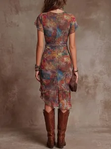 Back view of a slim-fit colorful abstract print midi dress with an asymmetrical hem