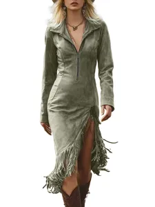 Detail view of the green suede texture and fringe hem on a western cowboy style dress.