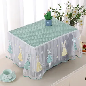 Green quilted microwave cover with white lace skirt and cute rabbit embroidery detail