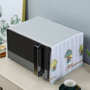 Quilted microwave dust cover with colorful embroidered mushroom design detail shot