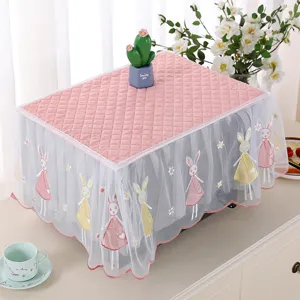 Detail view of pink quilted fabric microwave cover featuring cute rabbit embroidery lace