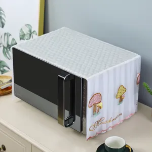 Detailed view of the embroidered mushroom pattern on the white lace microwave dust cover