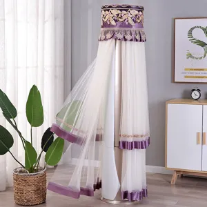 Elegante copertura antipolvere in pizzo viola per condizionatori a colonna cilindrici.