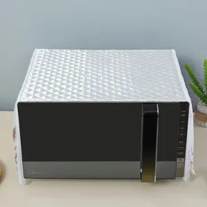High-quality white quilted microwave dust cover featuring elegant lace trim details