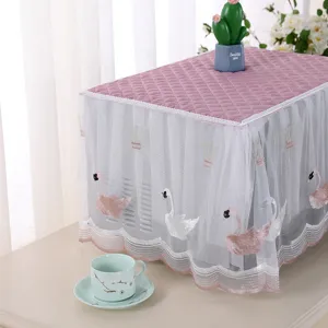 Detailed view of pink quilted microwave dust cover with white lace and swan embroidery