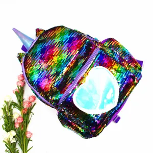 Close-up detail of a colorful mermaid sequin unicorn backpack with a blue heart patch
