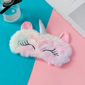 Plush unicorn sleep mask featuring a rainbow gradient design and a silver glitter horn detail
